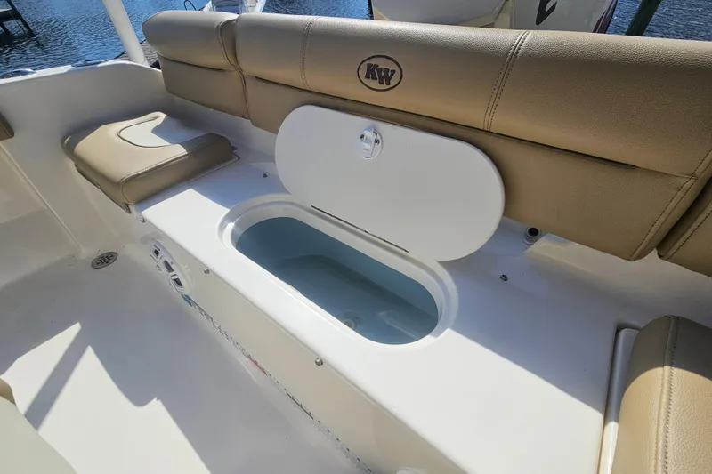 Slide: The Image of 2017 Key West 189 FS boat interior with seating and storage compartment. - 17