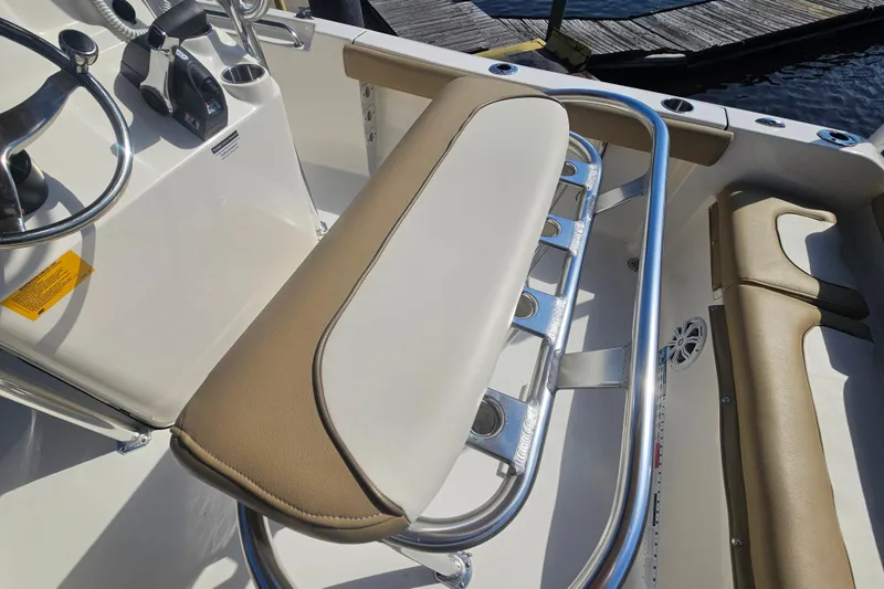Slide: The Image of 2017 Key West 189 FS boat interior with steering wheel and seating. - 18