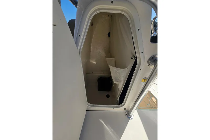 Slide: The Image of 2017 Key West 189 FS boat storage compartment with open door. - 23