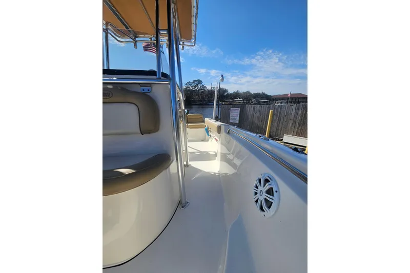 Slide: The Image of 2017 Key West 189 FS boat interior with seating and speaker, under clear blue sky. - 25