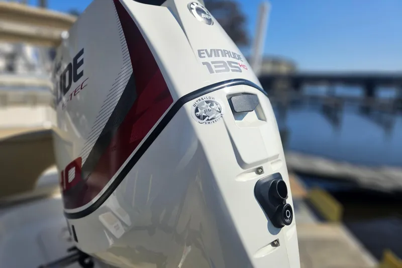 Slide: The Image of 2017 Key West 189 FS with Evinrude 135 HP engine at a marina. - 3