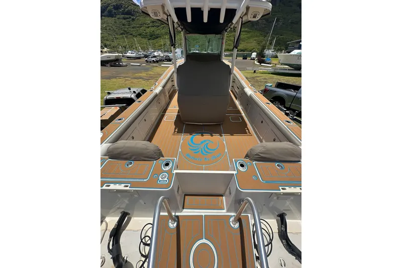Slide: The Image of 2020 World Cat 320 CC boat interior with custom deck design and seating. - 10