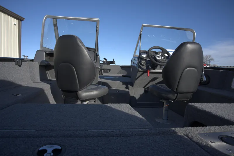 Slide: The Image of 2020 Tracker Pro Guide V-175 Combo boat interior with dual seats and steering wheel. - 4
