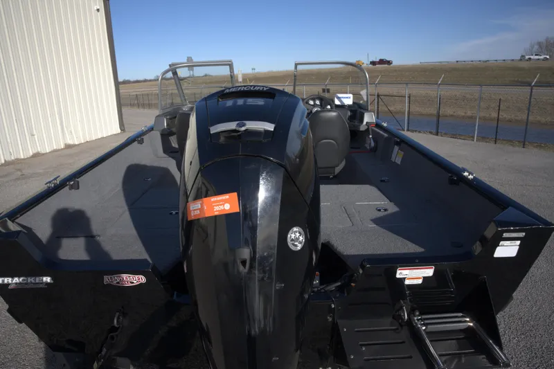 Slide: The Image of 2020 Tracker Pro Guide V-175 Combo boat with Mercury engine, parked outdoors. - 7