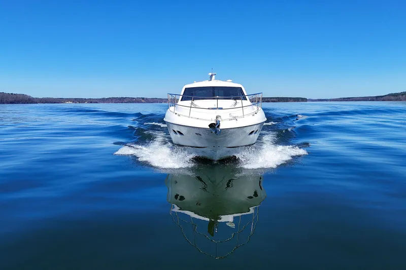 Slide: The Image of 2016 Sea Ray Sundancer 510 cruising on a clear blue lake under a bright sky. - 11
