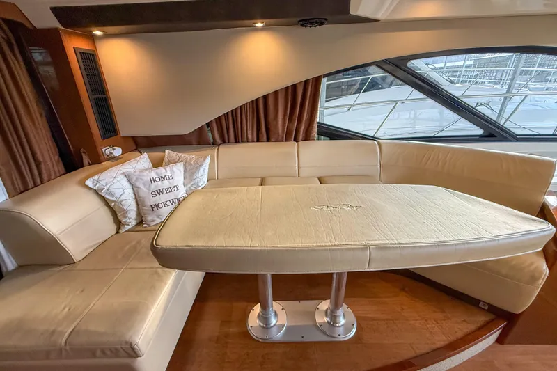 Slide: The Image of Luxurious interior of 2016 Sea Ray Sundancer 510 yacht with beige seating and table. - 14