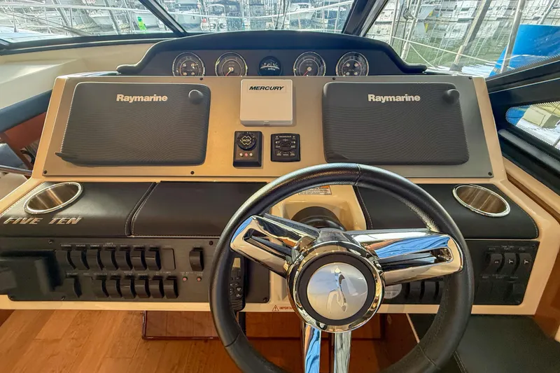 Slide: The Image of Helm of 2016 Sea Ray Sundancer 510 with Raymarine navigation system and Mercury controls. - 15