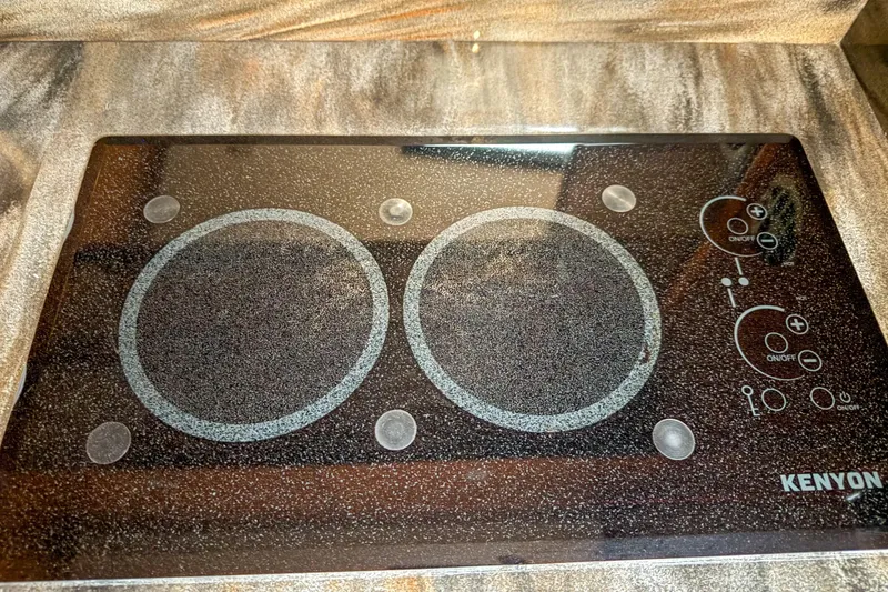 Slide: The Image of Kenyon electric cooktop on 2016 Sea Ray Sundancer 510 yacht kitchen counter. - 22