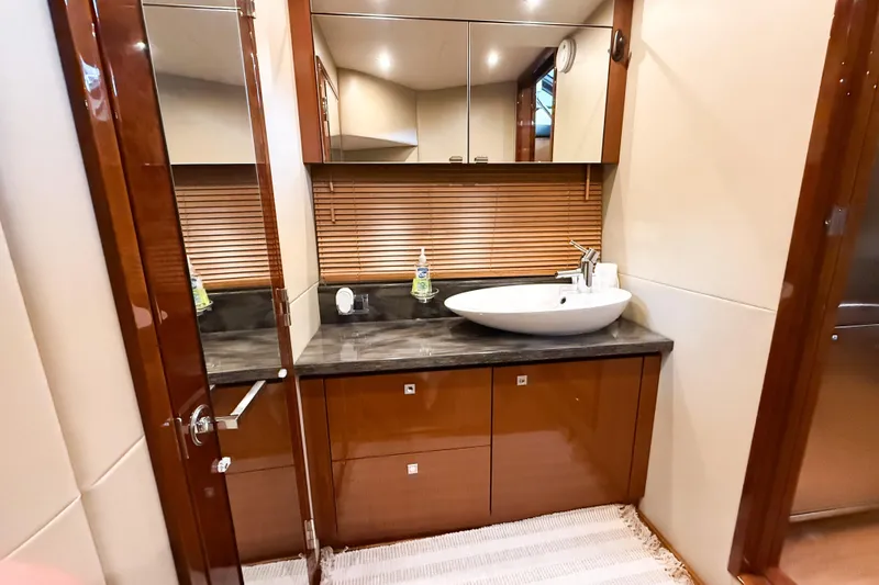 Slide: The Image of Luxurious bathroom interior of 2016 Sea Ray Sundancer 510 yacht with modern sink and cabinetry. - 28
