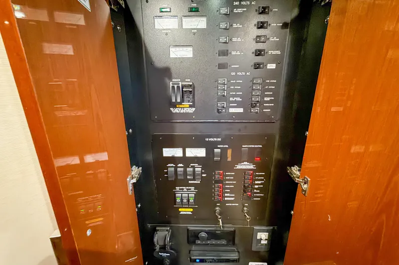Slide: The Image of Electrical control panel inside 2016 Sea Ray Sundancer 510 yacht, featuring switches and circuit breakers. - 30