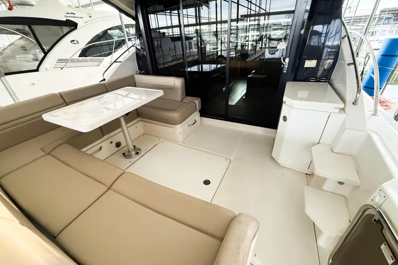 Slide: The Image of Luxurious 2016 Sea Ray Sundancer 510 yacht interior with elegant seating and table. - 31