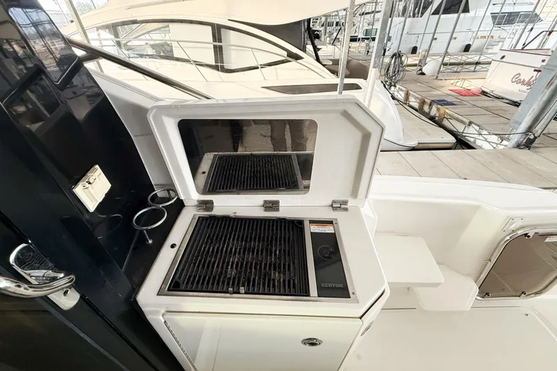 Slide: The Image of Outdoor grill on 2016 Sea Ray Sundancer 510 yacht deck, docked at marina. - 32