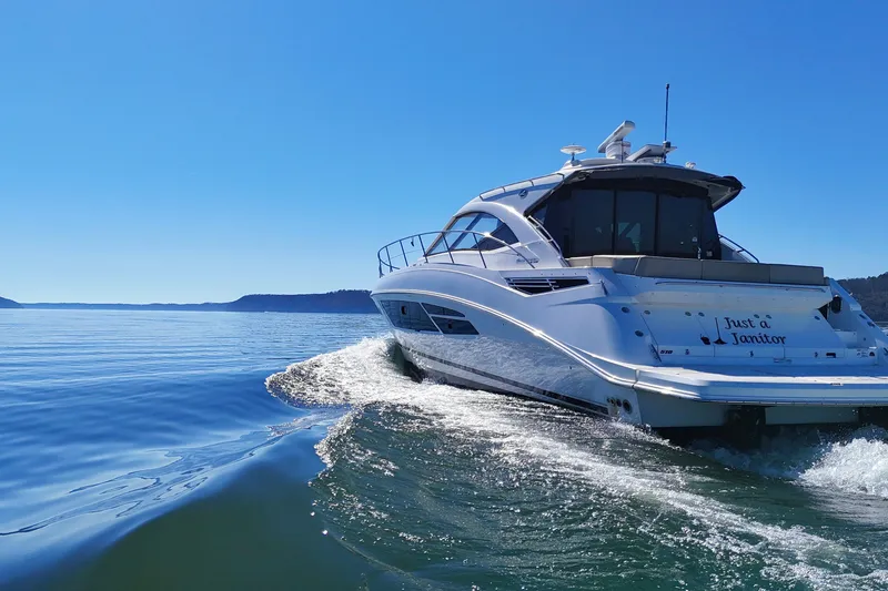 Slide: The Image of 2016 Sea Ray Sundancer 510 yacht cruising on a clear blue sea. - 8