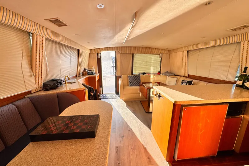 Slide: The Image of Luxurious interior of a 1999 Ocean Yachts 48 Super Sport, featuring elegant seating and modern amenities. - 11