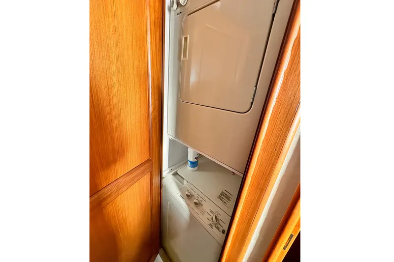 Slide: The Image of Stacked washer and dryer in 1999 Ocean Yachts 48 Super Sport. - 14