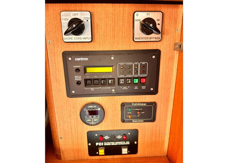 Slide: The Image of Control panel of a 1999 Ocean Yachts 48 Super Sport with various switches and displays. - 3