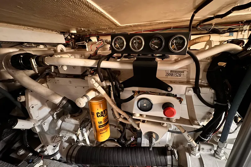 Slide: The Image of Engine room of a 1999 Ocean Yachts 48 Super Sport with gauges and CAT filter. - 4