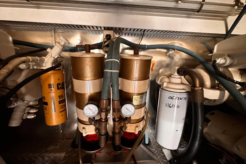Slide: The Image of Engine room of 1999 Ocean Yachts 48 Super Sport with fuel filters and gauges. - 5