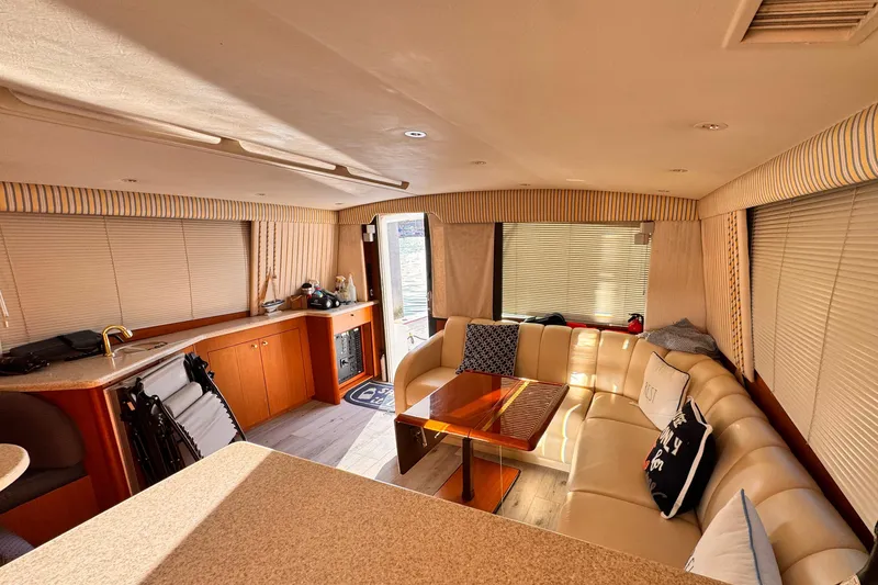 Slide: The Image of Luxurious interior of 1999 Ocean Yachts 48 Super Sport with plush seating and elegant decor. - 9
