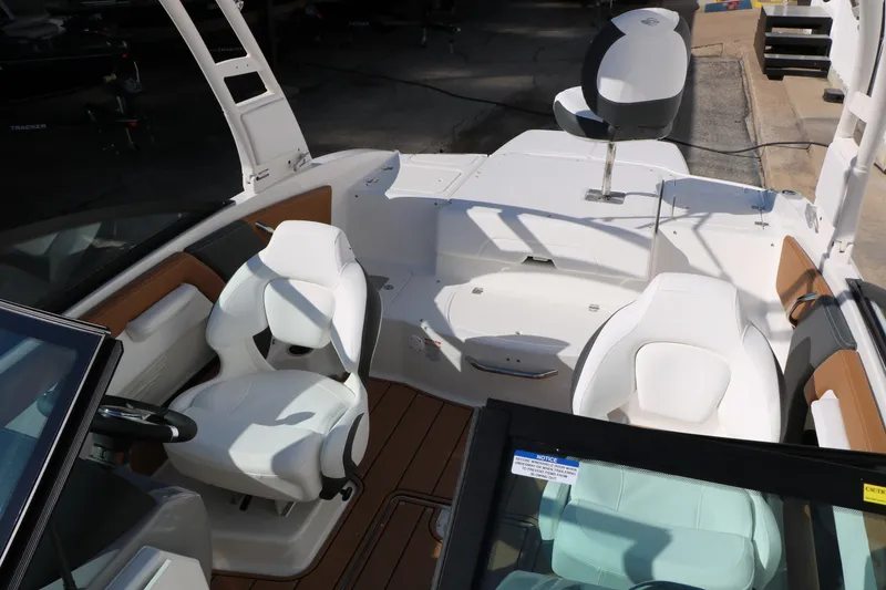 Slide: The Image of 2026 Chaparral 21 SSi Ski & Fish boat interior with white seating and modern design. - 20