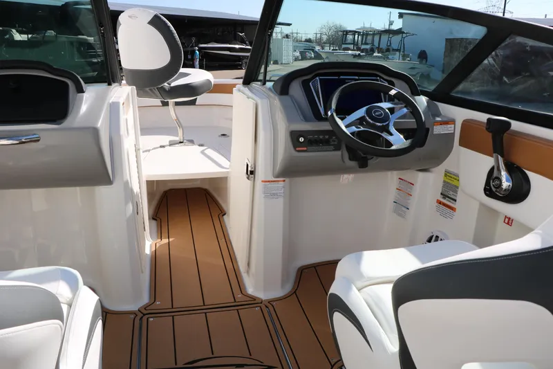 Slide: The Image of 2026 Chaparral 21 SSi Ski & Fish boat interior with modern dashboard and seating. - 22