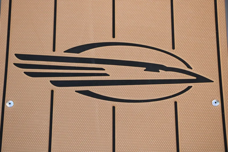 Slide: The Image of Chaparral 21 SSi Ski & Fish 2026 logo on textured brown surface. - 28