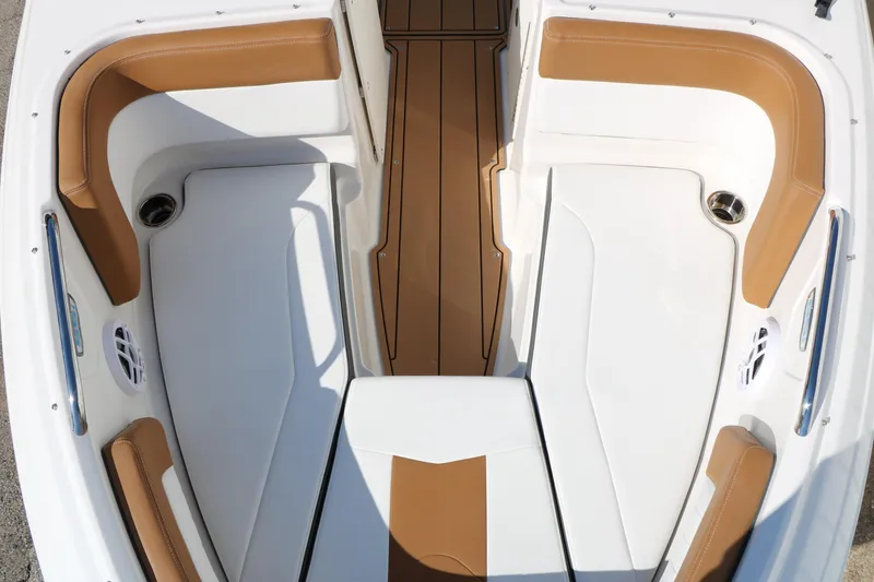 Slide: The Image of 2026 Chaparral 21 SSi Ski & Fish boat interior with tan and white seating. - 32