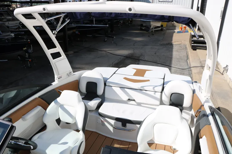 Slide: The Image of 2026 Chaparral 21 SSi Ski & Fish boat interior with white seating and sleek design. - 35