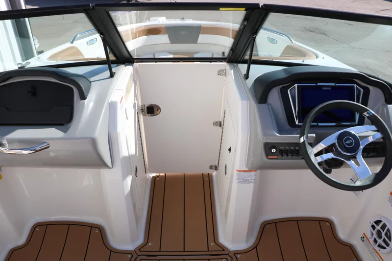 Slide: The Image of 2026 Chaparral 21 SSi Ski & Fish boat interior with steering wheel and dashboard. - 37