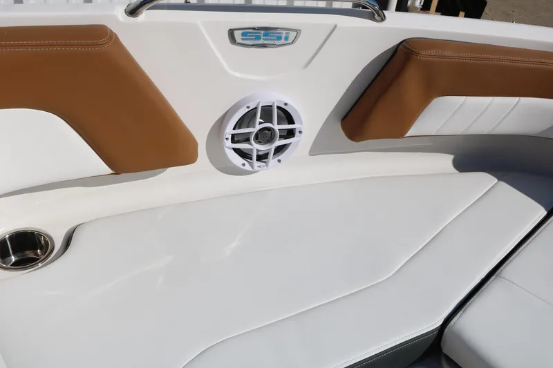 Slide: The Image of 2026 Chaparral 21 SSi Ski & Fish boat interior with speaker and cushioned seating. - 39