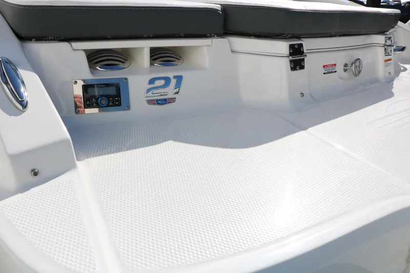 Slide: The Image of 2026 Chaparral 21 SSi Ski & Fish boat deck with audio controls and seating. - 43
