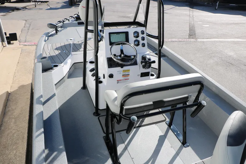 Slide: The Image of 2025 Vexus ACX 2210 boat interior with steering console and seating. - 17