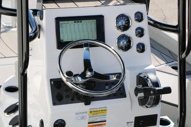 Slide: The Image of Steering console of 2025 Vexus ACX 2210 boat with gauges and controls. - 18