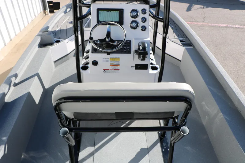 Slide: The Image of 2025 Vexus ACX 2210 boat interior with steering console and seating. - 19