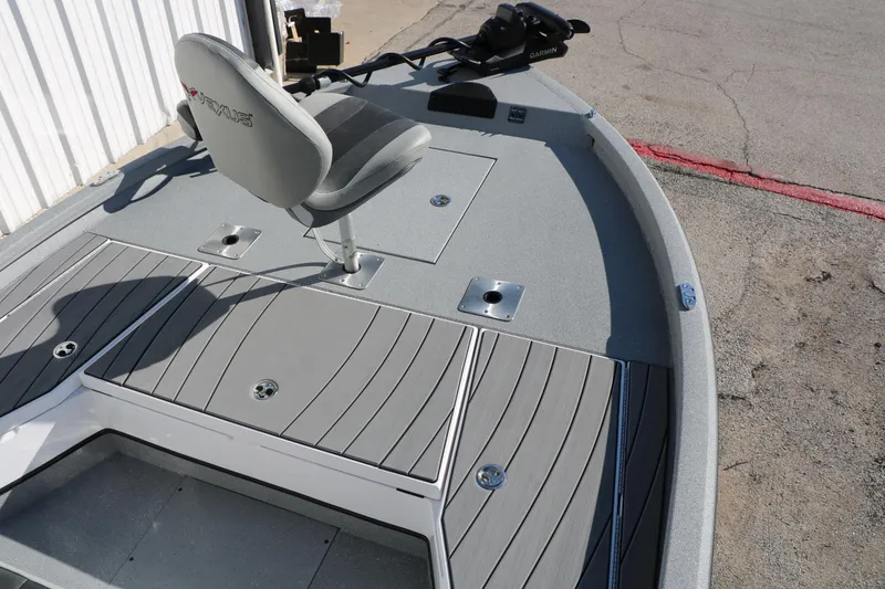 Slide: The Image of 2025 Vexus ACX 2210 boat deck with seating and Garmin equipment. - 21