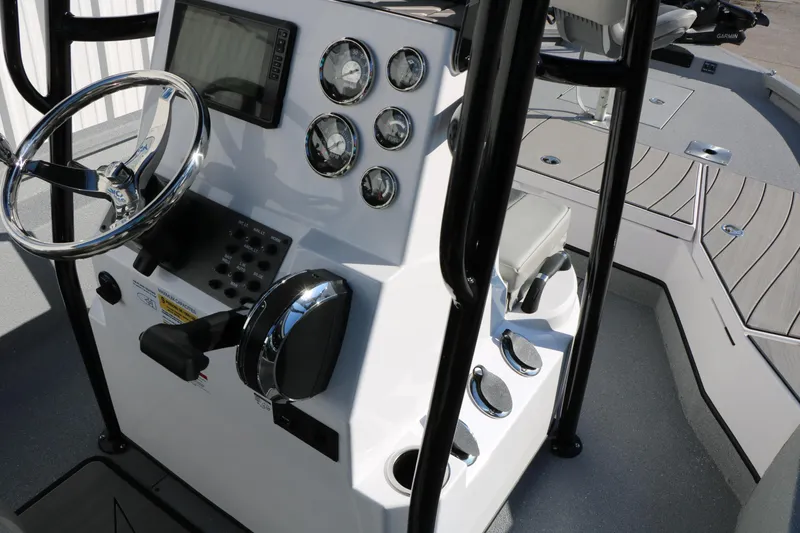 Slide: The Image of 2025 Vexus ACX 2210 boat console with steering wheel and gauges. - 29