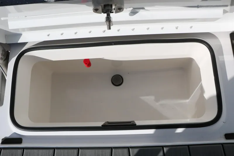 Slide: The Image of Livewell compartment in 2025 Vexus ACX 2210 boat, featuring a clean, spacious interior. - 31