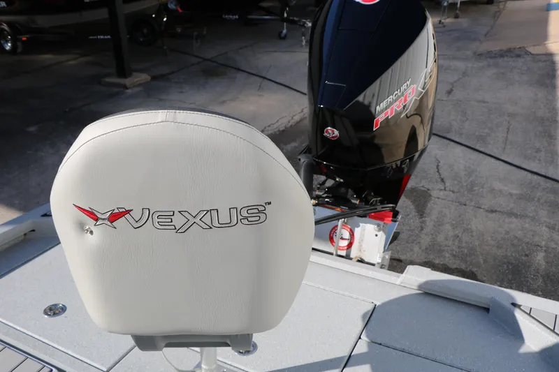 Slide: The Image of 2025 Vexus ACX 2210 boat seat and Mercury Pro engine on display. - 32