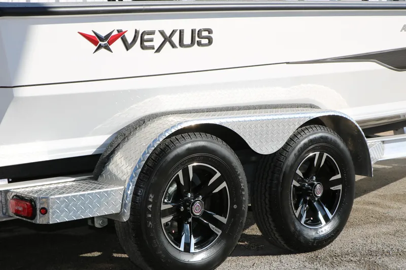 Slide: The Image of 2025 Vexus ACX 2210 boat trailer with dual black alloy wheels and diamond plate fenders. - 5