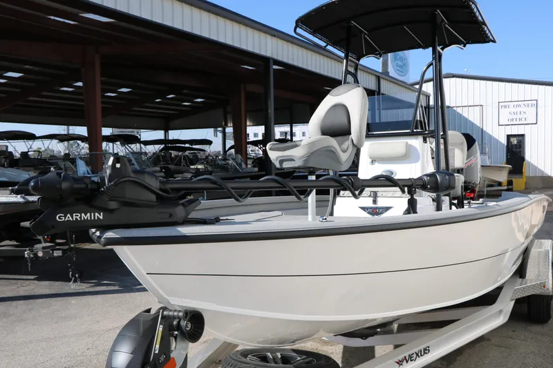 Slide: The Image of 2025 Vexus ACX 2210 boat with Garmin equipment, displayed at a dealership. - 8