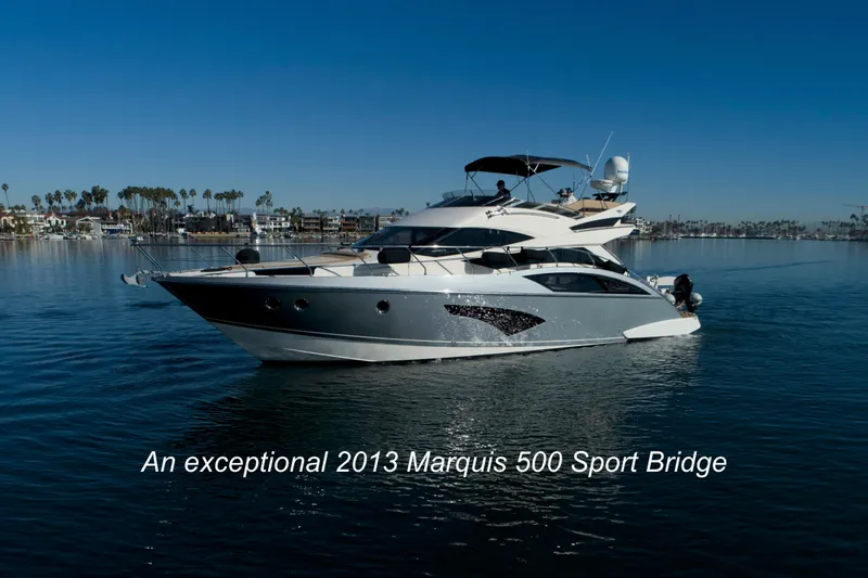 Slide: The Image of Luxurious 2013 Marquis 500 Sport Bridge yacht cruising on calm waters. - 2