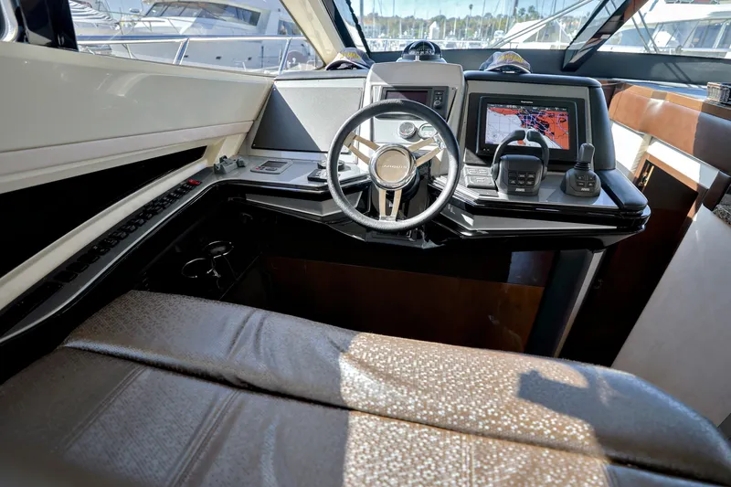 Slide: The Image of Interior cockpit of 2013 Marquis 500 Sport Bridge yacht with navigation equipment. - 27