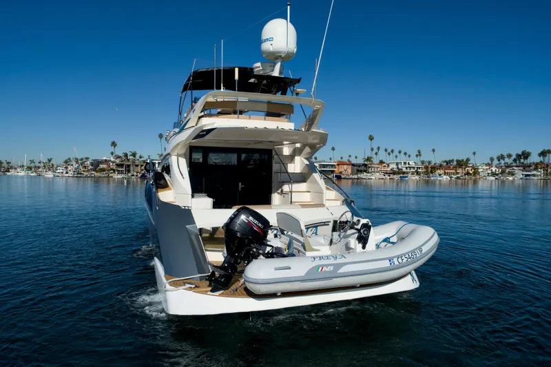 Slide: The Image of 2013 Marquis 500 Sport Bridge yacht cruising on a calm, sunny day. - 3