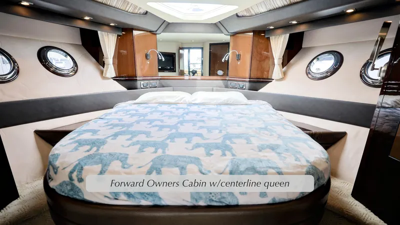 Slide: The Image of Forward owner's cabin with centerline queen bed in 2013 Marquis 500 Sport Bridge yacht. - 32