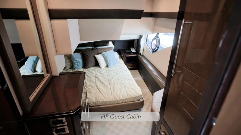 Slide: The Image of VIP guest cabin in 2013 Marquis 500 Sport Bridge yacht, featuring a cozy bed and elegant decor. - 34