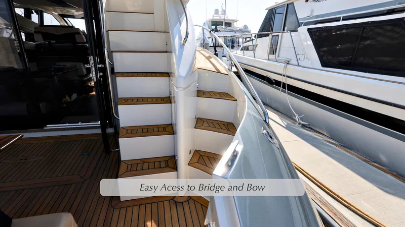 Slide: The Image of 2013 Marquis 500 Sport Bridge yacht with staircase to bridge and bow. - 6