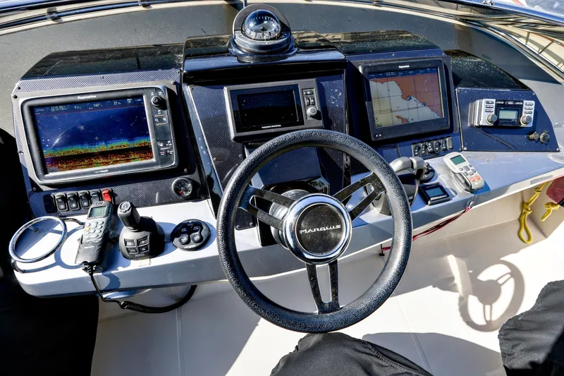 Slide: The Image of Helm of 2013 Marquis 500 Sport Bridge with navigation and control systems. - 8