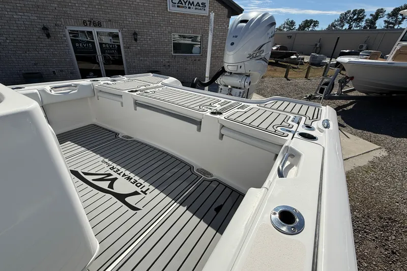 Slide: The Image of 2019 Tidewater 2700 Carolina Bay boat with Yamaha engine, displayed at dealership. - 11