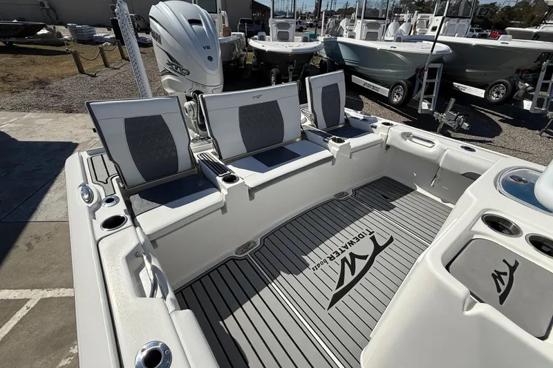Slide: The Image of 2019 Tidewater 2700 Carolina Bay boat interior with seating and Yamaha engine. - 13