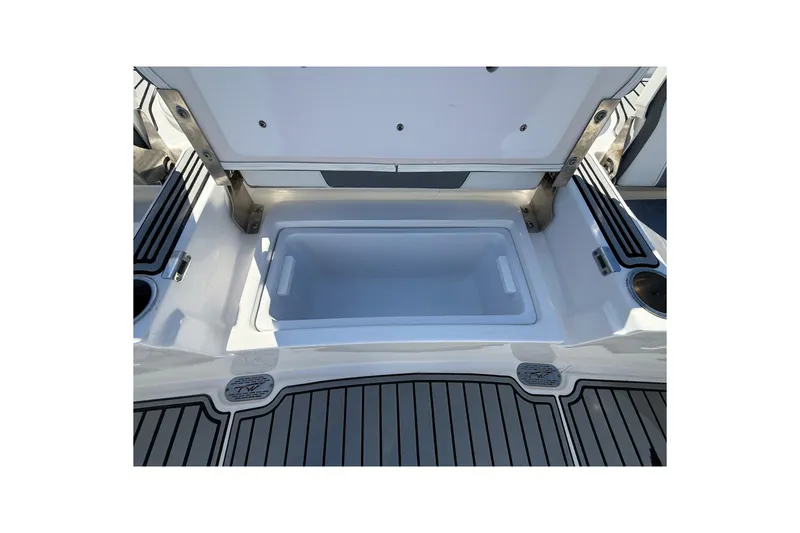 Slide: The Image of Open storage compartment on 2019 Tidewater 2700 Carolina Bay boat. - 15